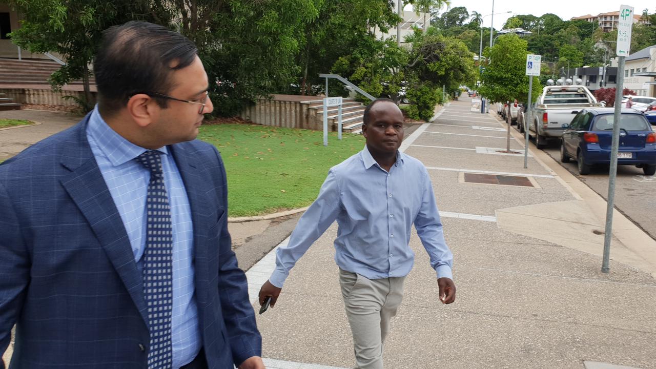 John Mugambi Mwamba (right) as supported by Defence lawyer Mathai Joshi in his appearance at the Townsville Magistrates Court on Tuesday. Photo: Leighton Smith