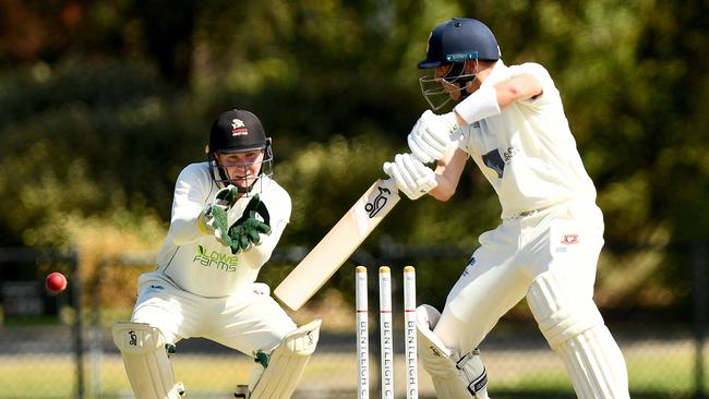 Jarrad Dowling cuts on his way to 83 for Bentleigh on Saturday. (Photo by Josh Chadwick)