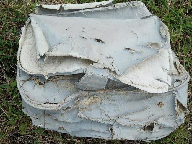 One of the 20 personal items found near suspected MH370 wreckage in Madagascar is this white bag Picture: Blaine A Gibson