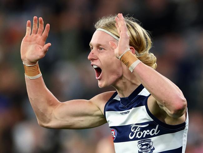 MELBOURNE, AUSTRALIA - JUNE 21: Oliver Dempsey of the Cats celebrates kicking a goal during the round 15 AFL match between Carlton Blues and Geelong Cats at Melbourne Cricket Ground, on June 21, 2024, in Melbourne, Australia. (Photo by Quinn Rooney/Getty Images)