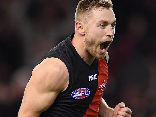 MELBOURNE, AUSTRALIA - JULY 27:  Devon Smith of the Bombers celebrates kicking a goal during the round 19 AFL match between the Essendon Bombers and the Sydney Swans at Etihad Stadium on July 27, 2018 in Melbourne, Australia.  (Photo by Quinn Rooney/Getty Images)