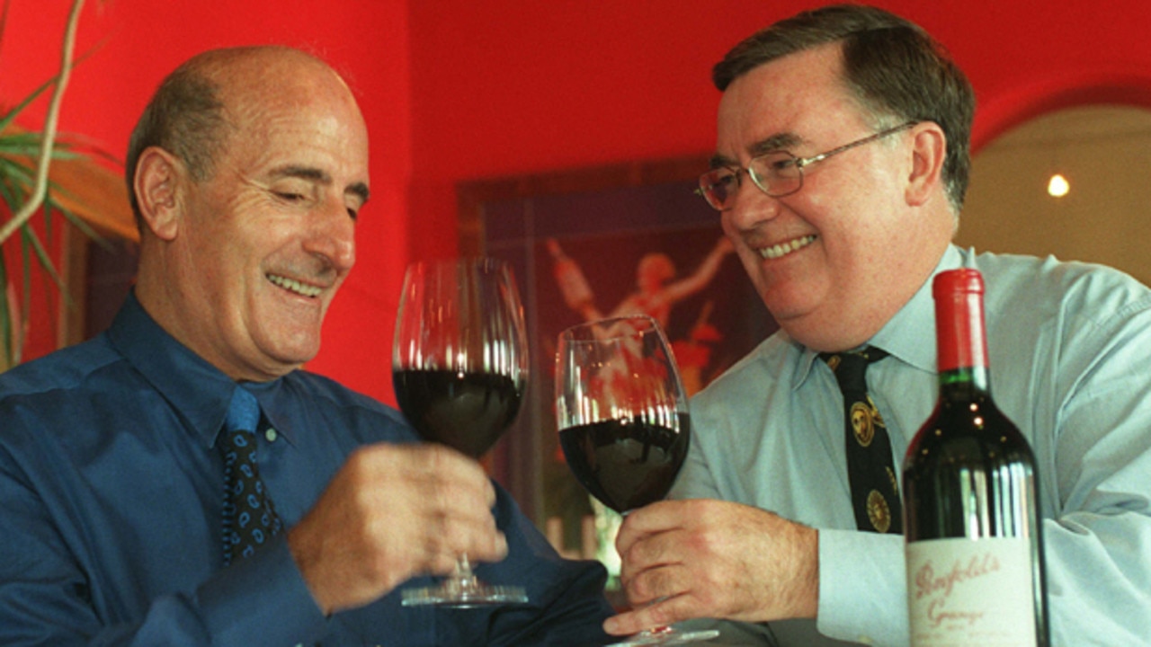 Grape hotel and bottle shop chain merger. Theo Karedis of Theo's Liquor Market Group (L) and Grape Management Group chairman Clive Kitchen celebrate their partnership (pictured in 1999).