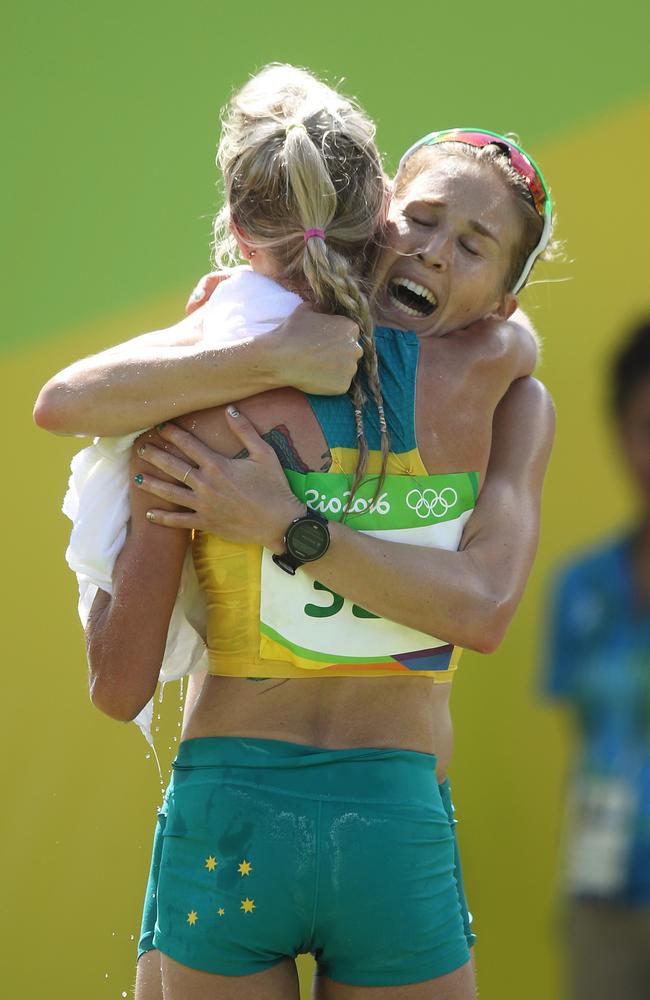 Australia's Jessica Trengove and Milly Clark embrace after the Women's Marathon Final.