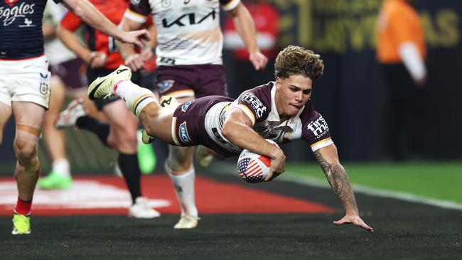 Reece Walsh dives over to score for the Broncos during last year’s NRL Las Vegas season opener. Photo by Ezra Shaw/Getty Images