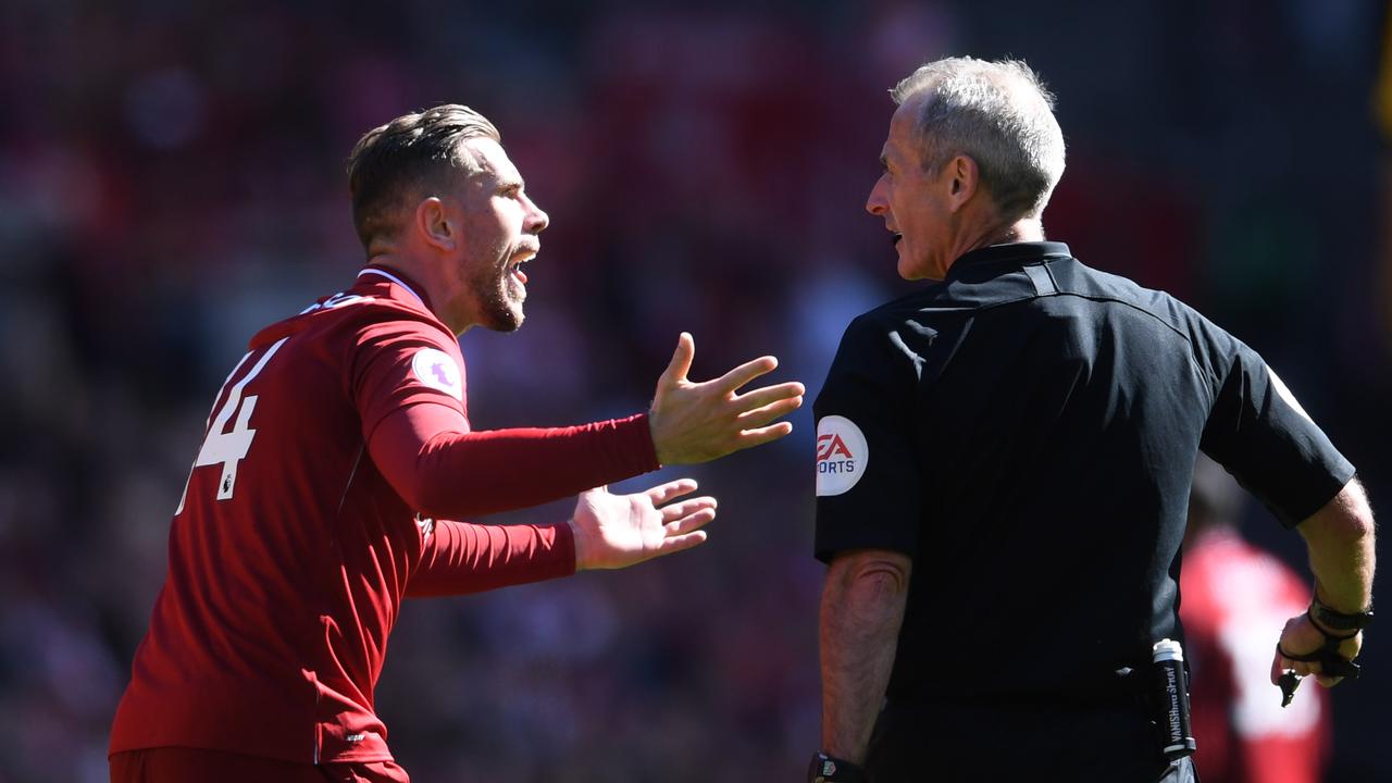 Jordan Henderson of Liverpool appeals to referee Martin Atkinson