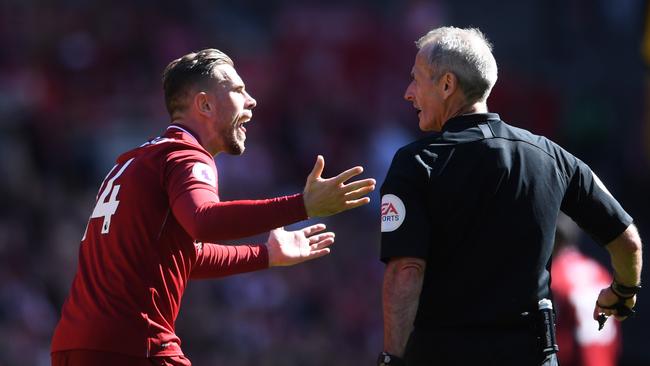 Jordan Henderson of Liverpool appeals to referee Martin Atkinson