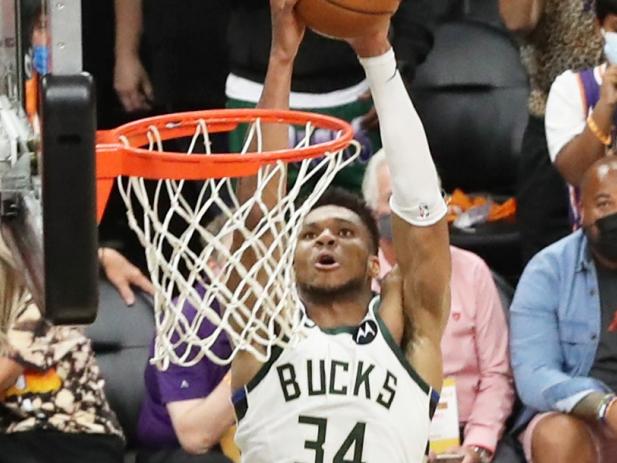 PHOENIX, AZ - July 17: Giannis Antetokounmpo #34 of the Milwaukee Bucks dunks the ball during the game against the Phoenix Suns during Game Five of the 2021 NBA Finals on July 17, 2021 at Footprint Center in Phoenix, Arizona. NOTE TO USER: User expressly acknowledges and agrees that, by downloading and or using this photograph, user is consenting to the terms and conditions of the Getty Images License Agreement. Mandatory Copyright Notice: Copyright 2021 NBAE (Photo by Joe Murphy/NBAE via Getty Images)