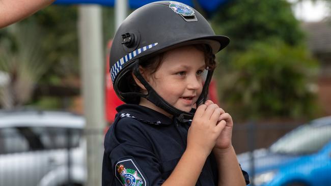 Savannah Burns buckles up her safety helmet as she prepares to joined the Queensland Mounted Police squad. PHOTO: Ali Kuchel