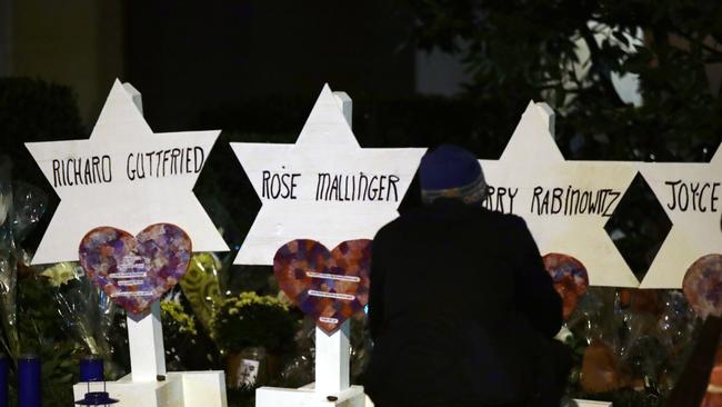 Stars of David with the names of those killed in a deadly shooting at the Tree of Life Synagogue stand in front of the synagogue in Pittsburgh, Sunday, Oct. 28, 2018. (AP Photo/Matt Rourke)