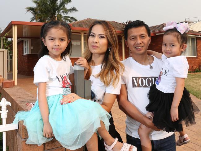 PARRAMATTA ADVERTISER/AAP. Trieu Nguyen with wife Pheobi Lam and daughters Elle(5) and Bella(4) pose for photos in Merrylands, Saturday, 14th December 2019. Real estate story about listing around the Christmas period and the local Merrylands property market. (AAP IMAGE / Robert Pozo)