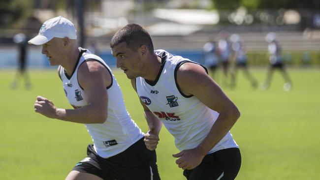 Tom Rockliff and Robbie Gray during pre-season training at Alberton Oval. Picture: Ben Macmahon/AAP