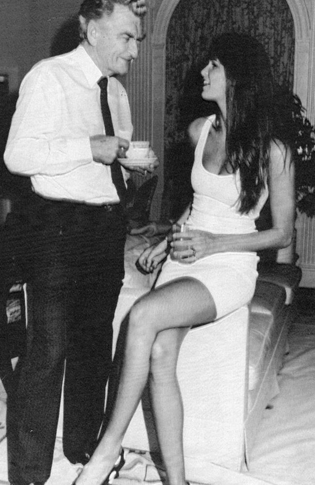 Prime Minister Bob Hawke speaks with model Elle Macpherson in 1988 during a breakfast given for prominent Australians at the Prime Minister's suite at the Waldorf-Astoria Hotel in New York. Picture: AP