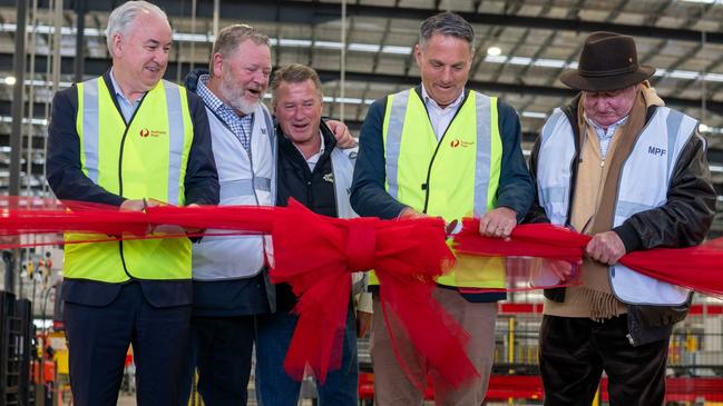 (From L to R) Paul Graham, David Fox, Andrew Fox, Defence Minister Richard Marles and Lindsay Fox open the new Australia Post parcel facility at Avalon, Victoria, on October 12, 2023. Picture: Supplied