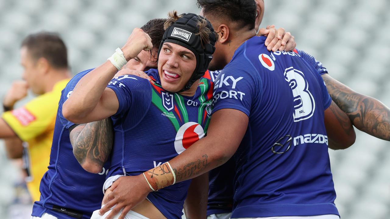 Reece Walsh of the Warriors celebrates with teammates.