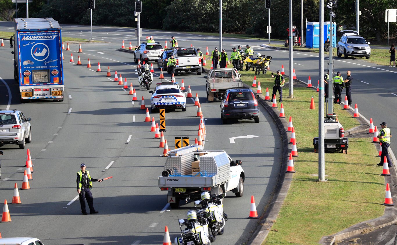 Queensland Police set up a road block due to the Corona Virus at the NSW / Queensland Border on the old Pacific Highway at Coolangatta. Photo: Scott Powick Newscorp