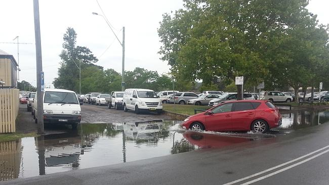 King tide floods streets, inundates wharves on Central Coast | Daily ...