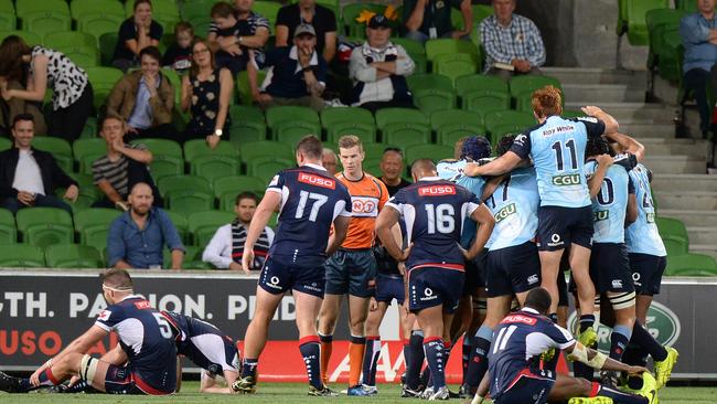 Waratahs players celebrate a win after the Round 5 Super Rugby match between the Melbourne Rebels and the NSW Waratahs at AAMI Park in Melbourne, Friday, March 24, 2017. (AAP Image/Mal Fairclough) NO ARCHIVING, EDITORIAL USE ONLY