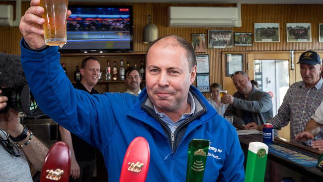 Josh Frydenberg visits the Auburn Bowls Club and toasts his success. Picture: Jake Nowakowski