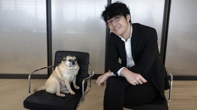 Oki Sato, founder of Japanese design studio Nendo, with his dog Kinako, in his office in Tokyo. Picture: Megan Miller