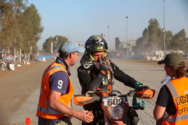 Mount Gambier's Nathan Hunter wipes his face after completing the 2019 Tatts Finke Desert Race. Pic: MATT HENDERSON