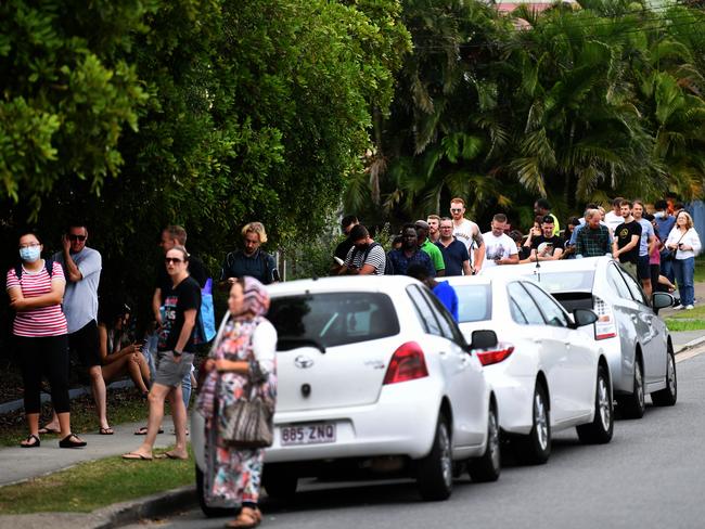 People queue outside a Centrelink office in Brisbane. Picture: AAP.