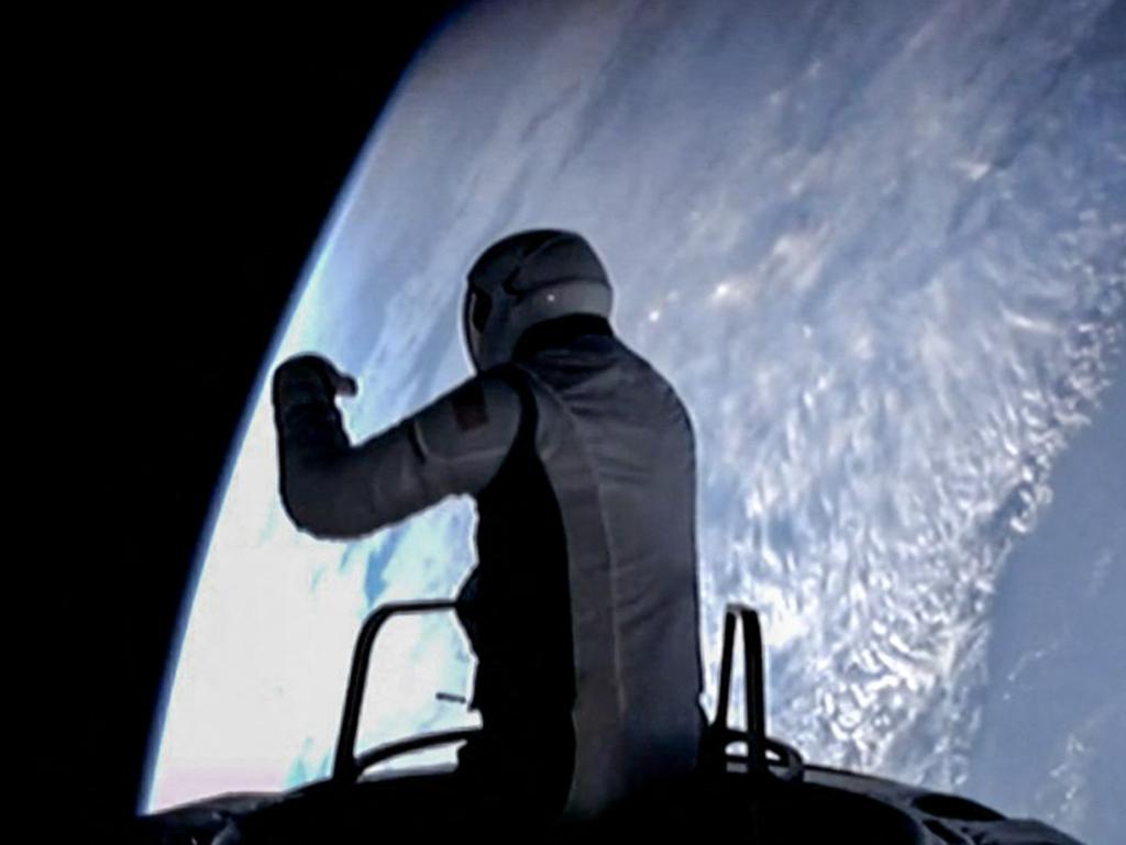 TOPSHOT - This still image taken from a SpaceX and Polaris broadcast on September 12, 2024, shows US fintech billionaire Jared Isaacman (EV1) peeking out to space from a hatch structure called "Skywalker", during the first private spacewalk performed by the crew of the SpaceX Polaris Dawn mission. After trekking deeper into space than any humans in the last half-century, a pioneering private crew is set to make history September 12, 2024, with the first-ever spacewalk by non-professional astronauts. The SpaceX Polaris Dawn mission, led by fintech billionaire Jared Isaacman, launched early Tuesday from the Kennedy Space Center in Florida, reaching a peak altitude of 870 miles (1,400 kilometers). (Photo by Polaris Program / AFP) / RESTRICTED TO EDITORIAL USE - MANDATORY CREDIT "AFP PHOTO / SpaceX / Polaris" - NO MARKETING NO ADVERTISING CAMPAIGNS - DISTRIBUTED AS A SERVICE TO CLIENTS