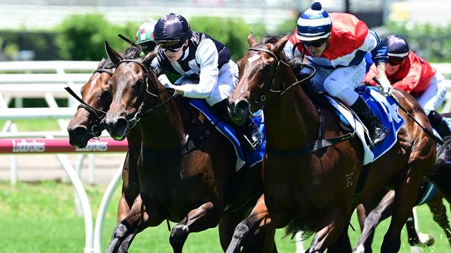 Tony Gollan trained filly Formula Rossa, wearing the black and white Black Soil Bloodstock colours, scores at Eagle Farm on Saturday to all but seal her spot in the Gold Coast Magic Millions 2YO Classic. Picture: Grant Peters, Trackside Photography.