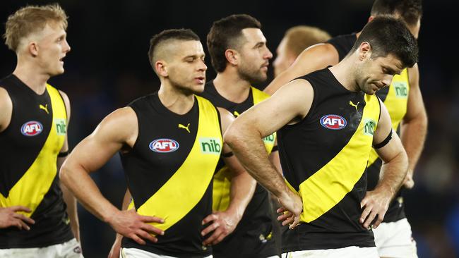 Dejected Tigers players leave the field after being beaten by bottom-placed North Melbourne.