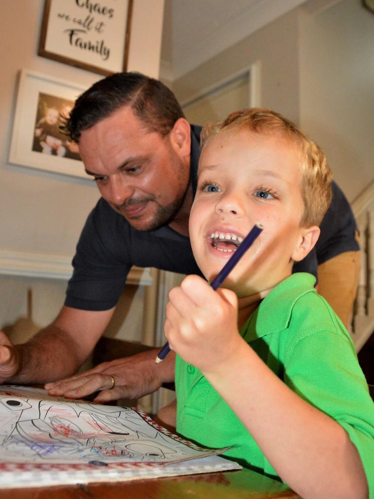 Toowoomba five-year-old Alfie Bell, pictured with his dad Nathan, has currently been left without a school to attend due to his complex disabilities, which have been deemed too difficult for the Diocese of Toowoomba Catholic Schools but are not severe enough for the special schools system.