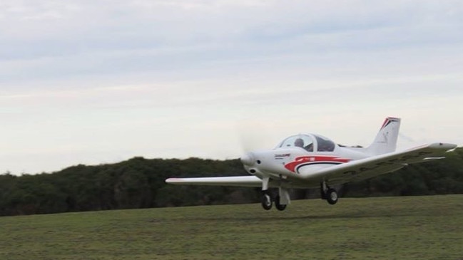 Lesleigh Griffin, 71, who had an emergency landing at Wynyard Airport with her twin sister Billie Hicks behind the tail of their plane. Picture: Supplied