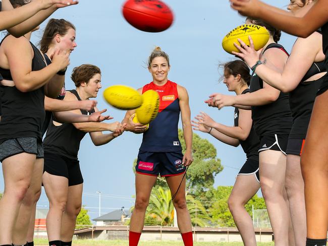 Mel Hickey puts some young footballers through their paces at Coburg City Oval. Picture: Ian Currie