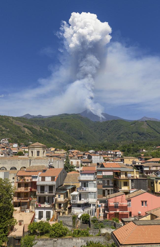 Smoke billows from Mount Etna volcano, seen from the village of Zafferana Etnea, Italy, Monday, June 2, 2025. (AP Photo/Giuseppe Distefano)