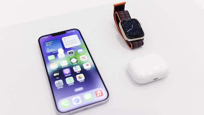 The new iPhone 14 is displayed alongside the new Apple Watch 8 Series and new AirPod Pros during a launch event at Apple Park in Cupertino, California. Picture: Brittany Hosea-Small/AFP