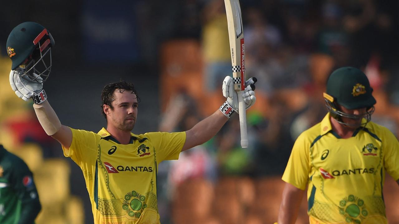 Australia's Travis Head (L) celebrates after scoring a century during the first one-day international (ODI) cricket match between Pakistan and Australia at the Gaddafi Cricket Stadium in Lahore on March 29, 2022. (Photo by Arif ALI / AFP)