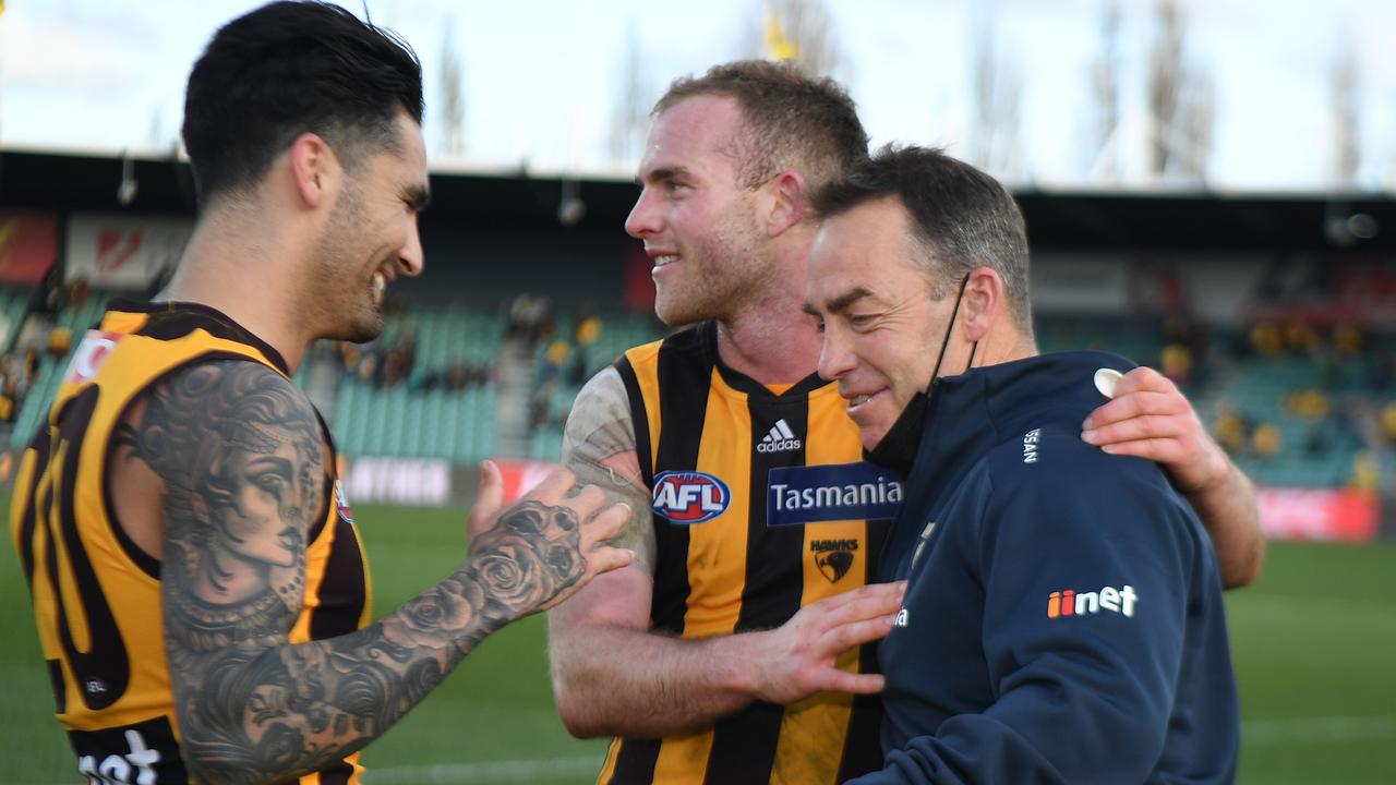 Outgoing Hawks coach Alastair Clarkson celebrates their upset win with Tom Mitchell and Chad Wingard. Picture: AFL Photos/via Getty Images