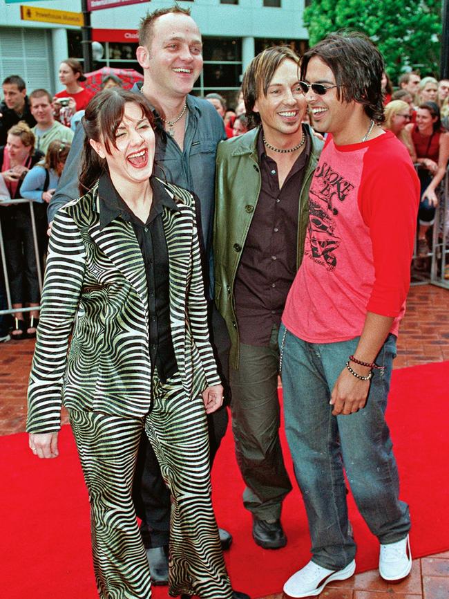 On the red carpet at the Aria Awards in 2000 with members of the band Taxiride. (Picture: Mick Tsikas)