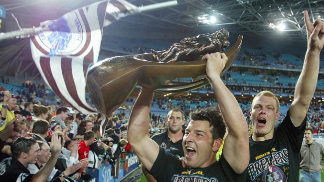 Panthers captain Craig Gower and Luke Lewis celebrate after the club’s most recent premiership in 2003. Picture: Gregg Porteous