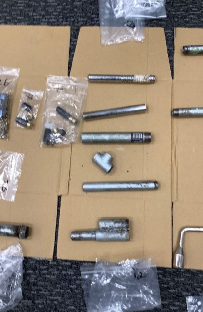 Police find a stash of homemade weapons, charging two men.