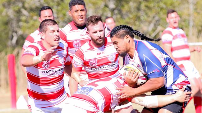 Vela is tackled by Currumbin defenders during the Rugby League Gold Coast grand final qualifier at Galleon Way. Picture: Supplied