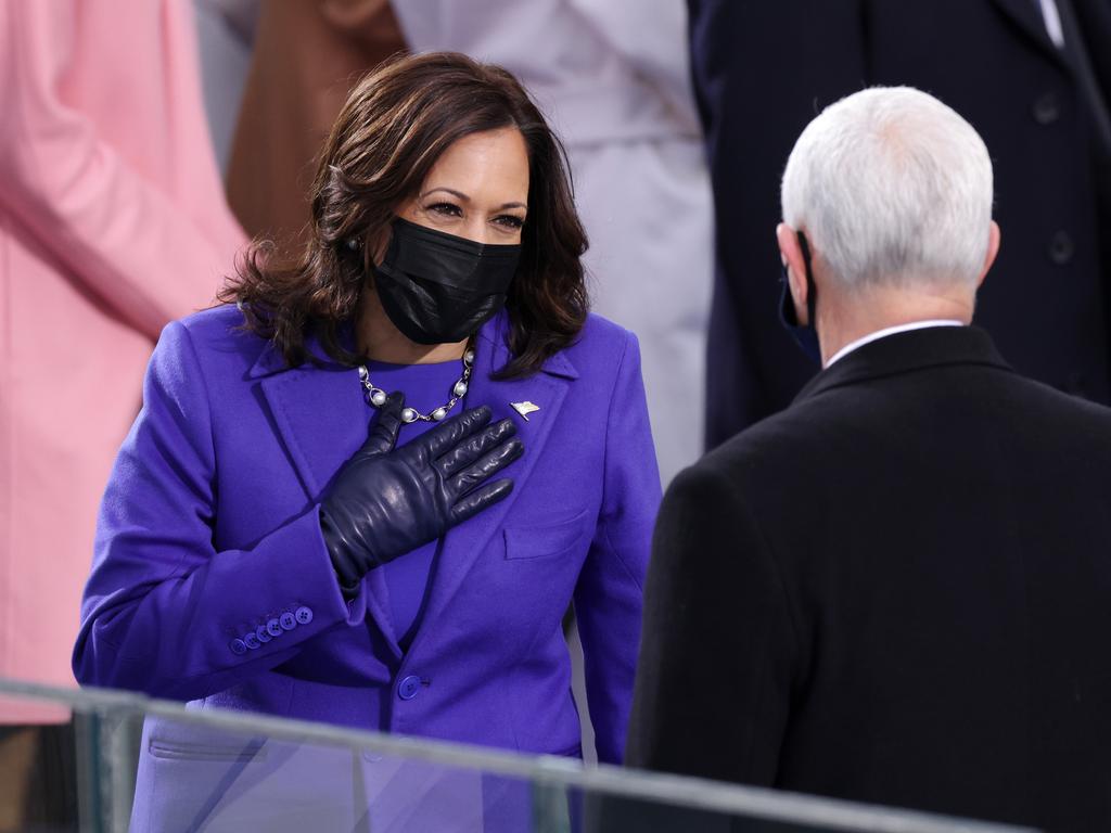 Kamala Harris, greeting outgoing VP Mike Pence, made history as America’s first female and woman of colour Vice President. Picture: Getty Images