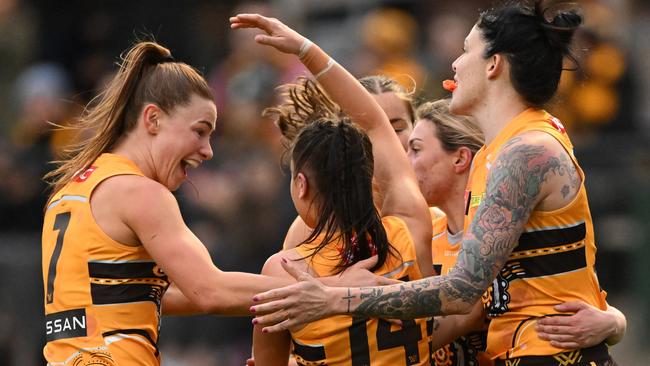 Charlotte Baskaran celebrates a goal with teammates. Picture: Morgan Hancock/AFL Photos/via Getty Images