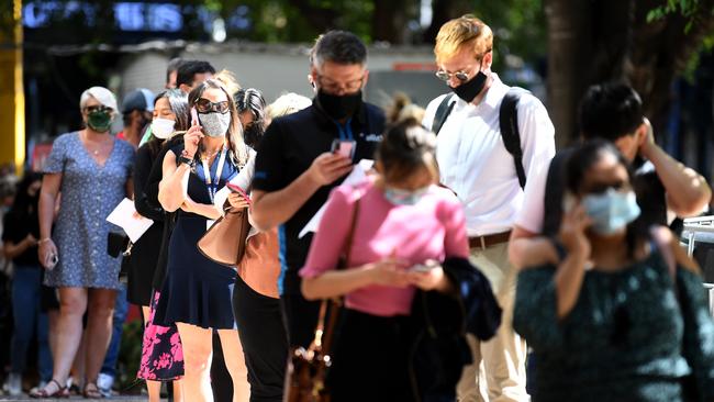 People line up outside a Covid-19 vaccination hub at the Brisbane Convention and Exhibition Centre on Tuesday. Picture: Dan Peled