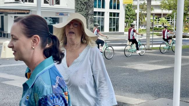 Health Minister Yvette D'Ath leaves a media conference on the Cairns Esplanade after it is gatecrashed by an anti-vaxxer. Picture: Chris Calcino