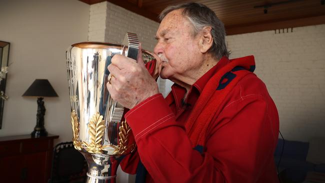 Ron gives the elusive trophy a welcome kiss. Picture: David Caird