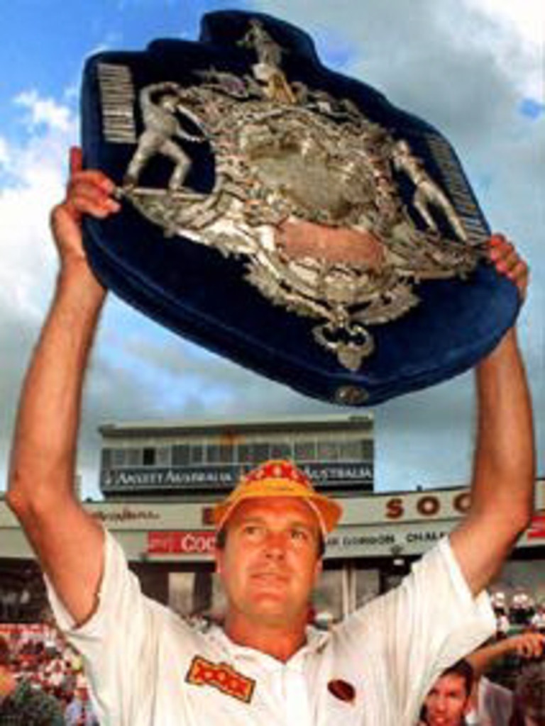 Qld's Carl Rackemann holds aloft the state’s first Sheffield Shield.