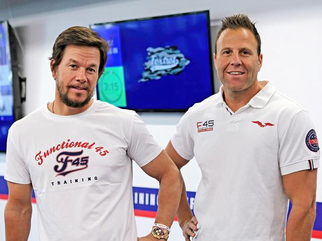 F45 owner Rob Deutsch, right, with actor Mark Wahlberg, who bought a minority stake in the company in 2019. Picture: Instagram / F45 Training