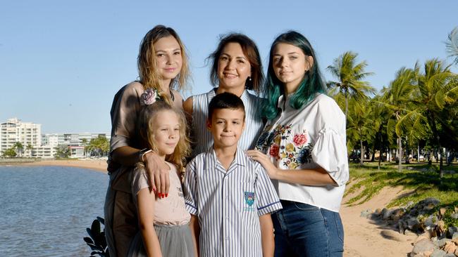 Marina Iashchenko with daughter Sofia Iashchenko, 8, with sister Iryna Tsiura with son Oleksandr Isivra, 9, and daughter Mariia Tsiura on the Strand. Picture: Evan Morgan