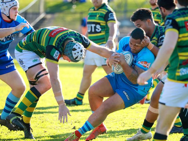 Two Blues player Tala Moli under heavy pressure from the defence. Picture: AAP