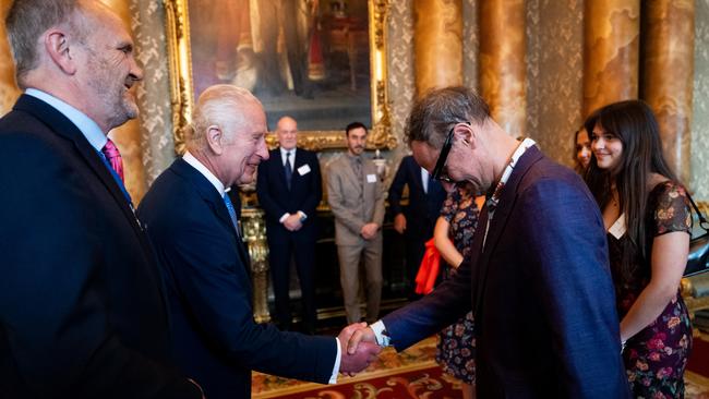 King Charles III greets artist Jonathan Yeo at the unveiling of the portrait. Picture: Aaron Chown-WPA Pool/Getty Images