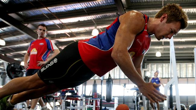 Shaun Higgins does push ups during pre-season.